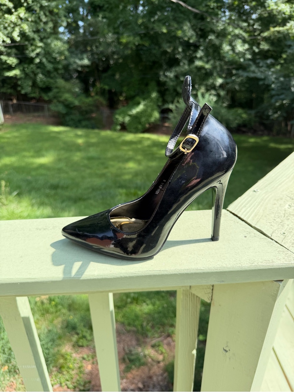 Sexy black patent leather stiletto pump with ankle strap